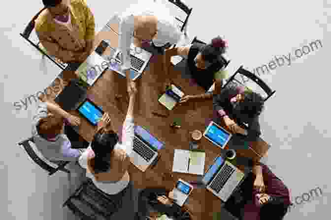 A Group Of Employees Brainstorming Around A Table, Representing The Innovative Spirit That Drives Organizational Success Clarity First: How Smart Leaders And Organizations Achieve Outstanding Performance