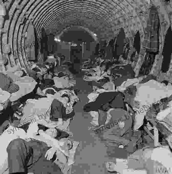 A Group Of People Huddled Together In A Bomb Shelter During World War Two Britain. Life In World War Two Britain: Living History