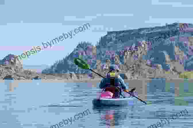 Kayaker Paddling On A Lake In Washington State Ray S Guides: Free Campgrounds In Washington State